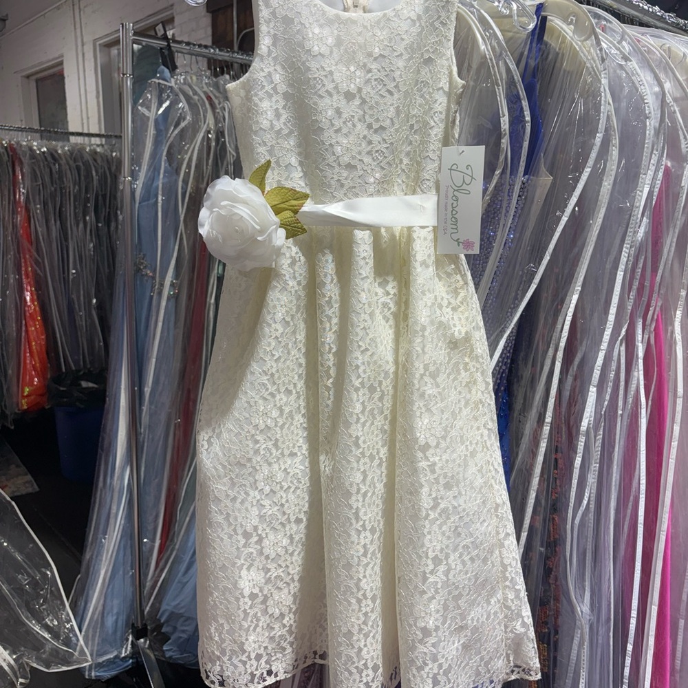 The Blossom Apparel Cream Lace Kids Dress with Floral Accent